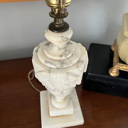 Marble lamp with intricate design on a wooden surface