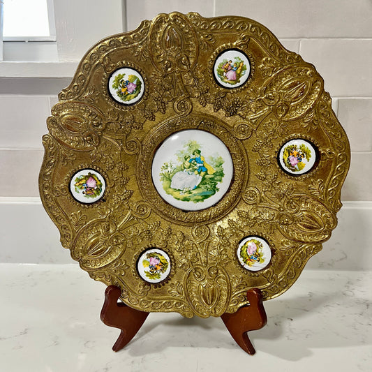 Gold plate on stand on white background