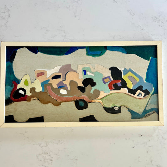 An abstract framed painting featuring organic shapes and blocks of teal, beige, brown, black, red, and light blue, mounted on a light-colored wall.