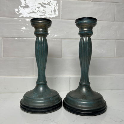 blue candle holders on a tiled background
