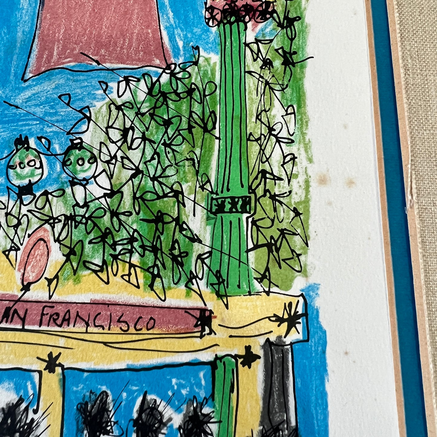 A close-up of a colorful hand-drawn illustration on paper, depicting a street scene with the text 'SAN FRANCISCO' and abstract figures, with a blue border visible on the right.