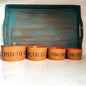 4 piece teak snack bowl set with bold orange interior blue tray on white marble