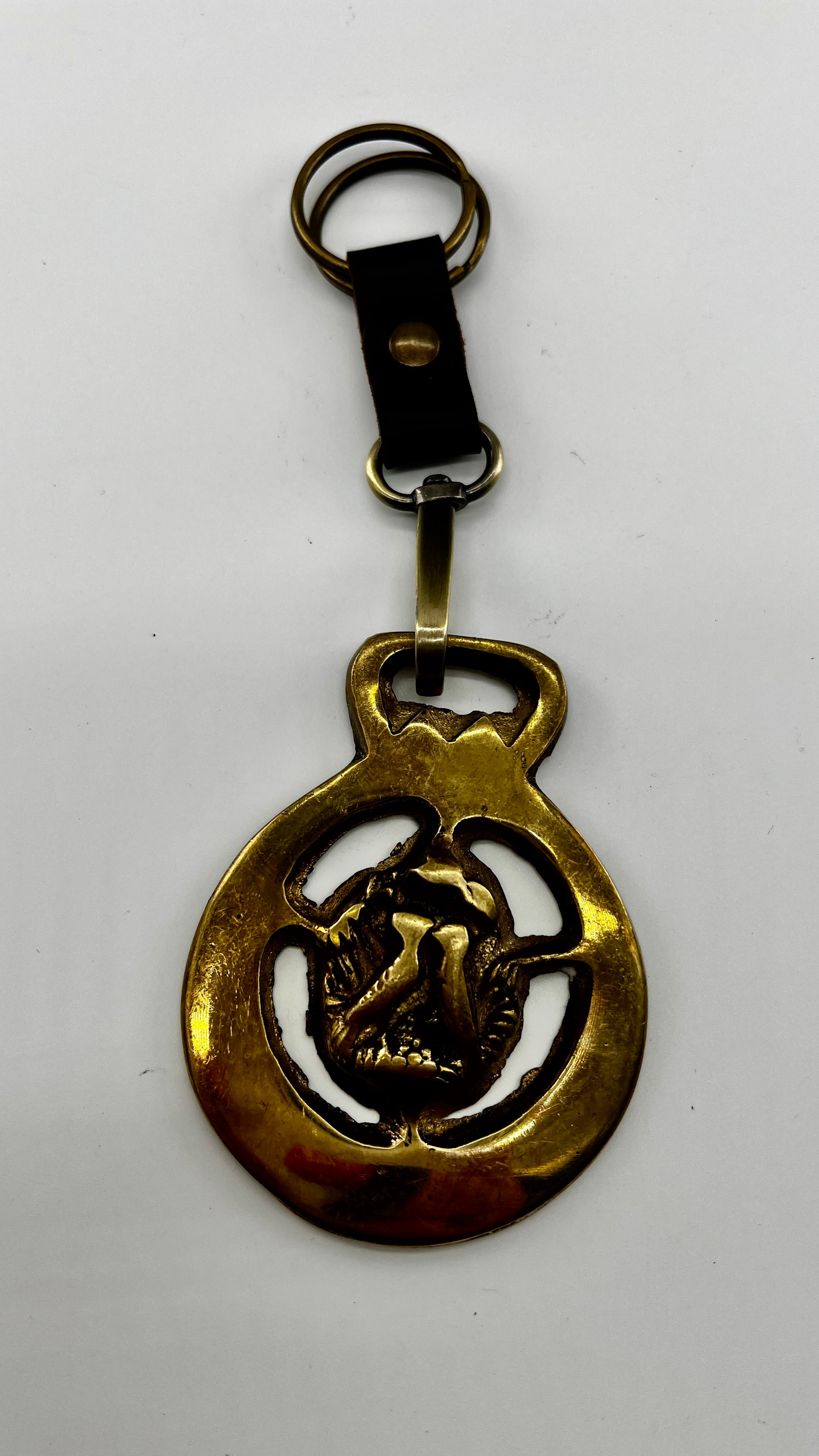 Vintage brass love birds medallion keychain with leather loop and brass key ring.