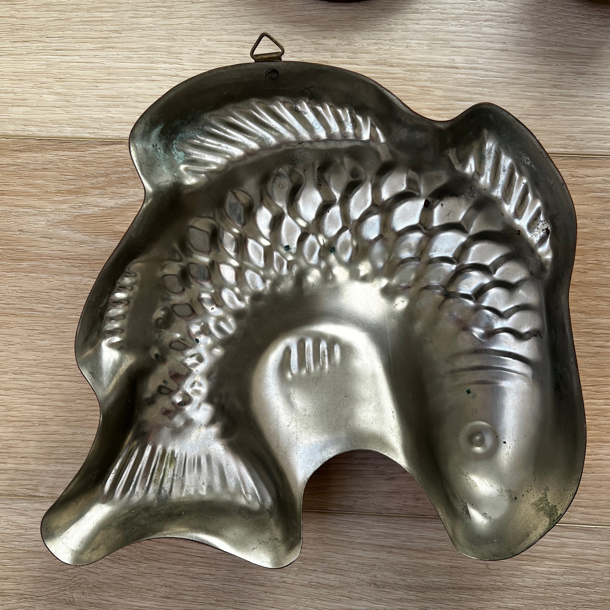 Vintage copper fish mold hanging wall décor — rustic coastal kitchen collectible.