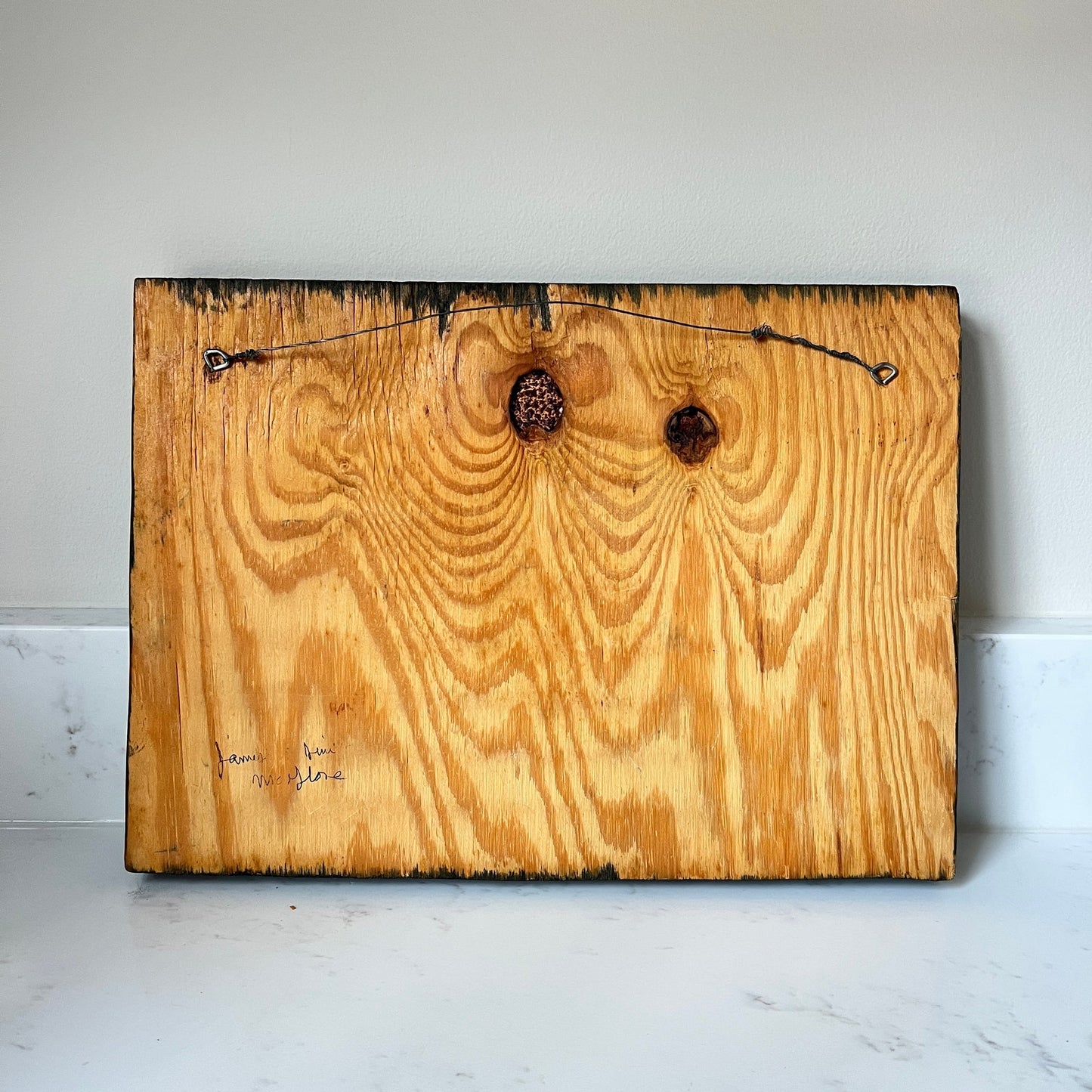 Wooden board with natural grain and texture on a white surface
