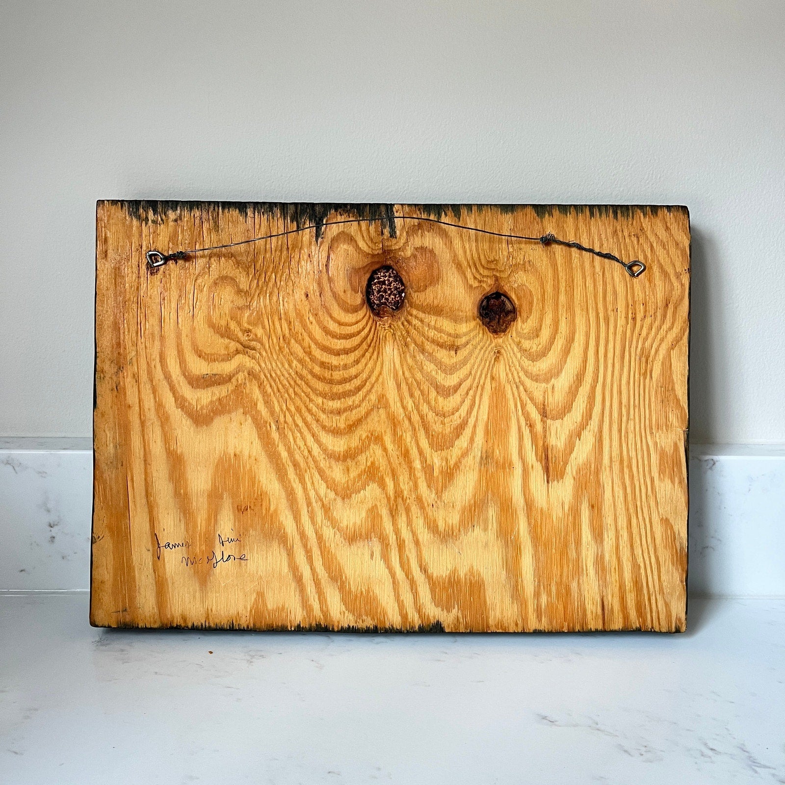 Wooden board with natural grain and texture on a white surface