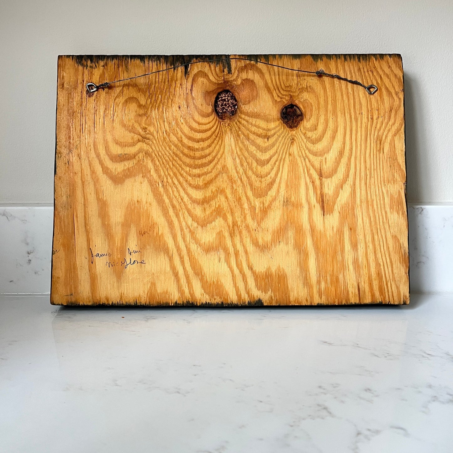 Wooden board with a rustic finish on a marble surface