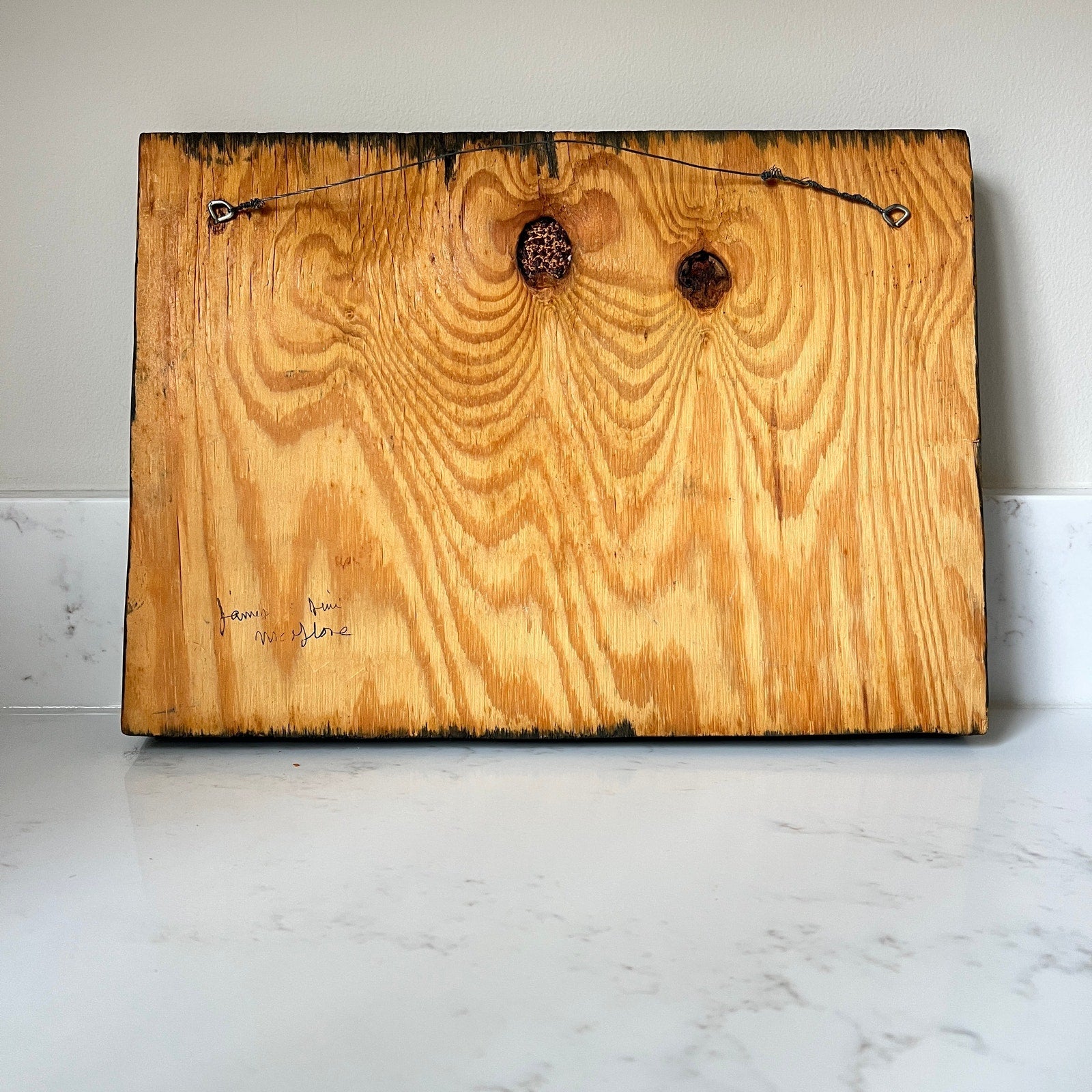 Wooden board with a rustic finish on a marble surface