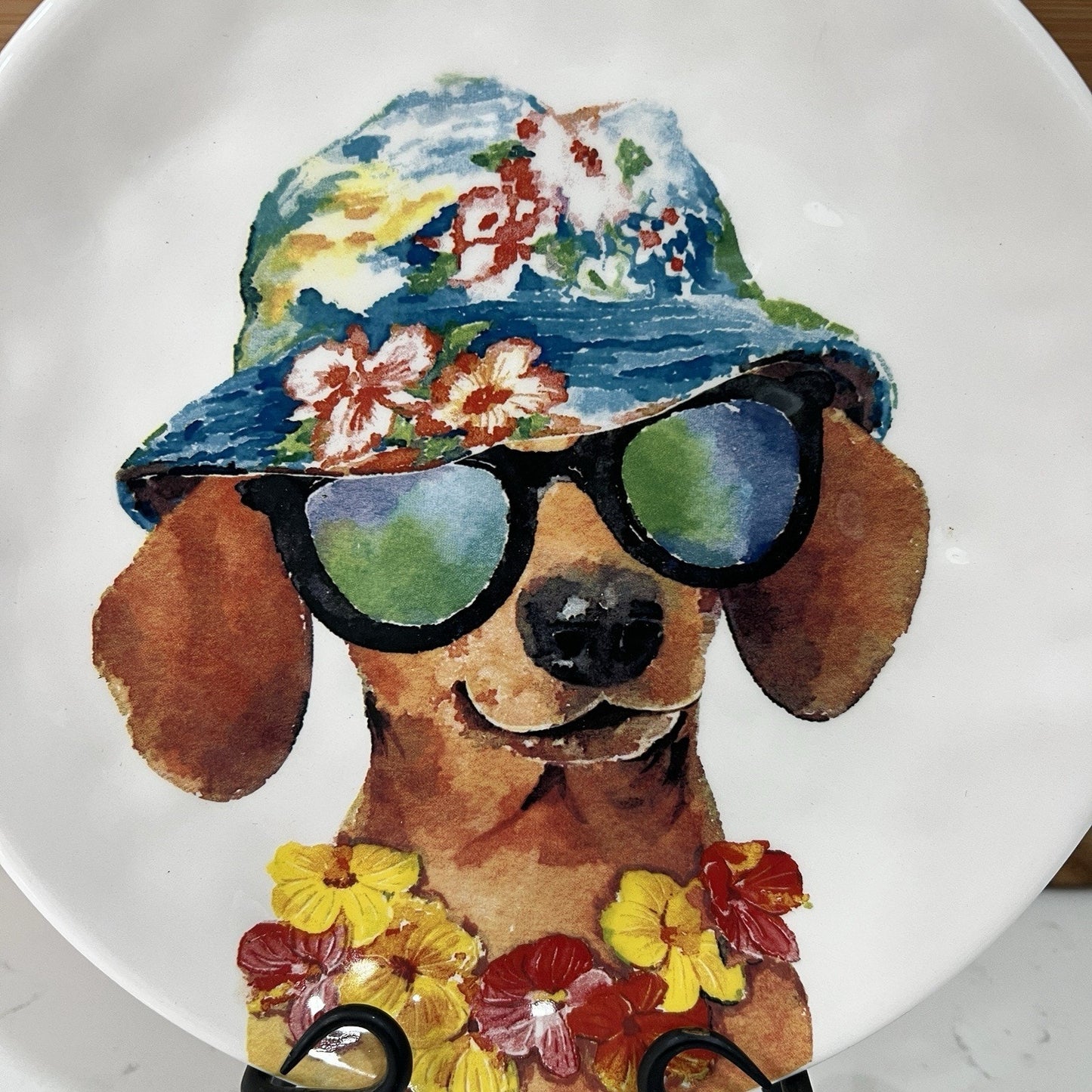 Artistic depiction of a dog wearing sunglasses and a floral hat on a white background