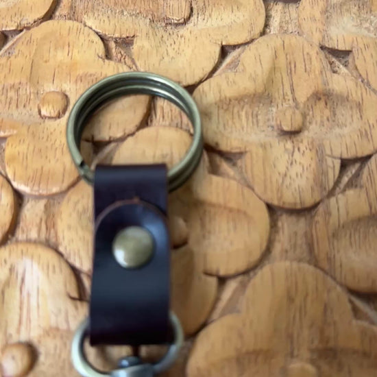 Video of William Shakespeare Horse Brass Medallion Keychain on wooden board