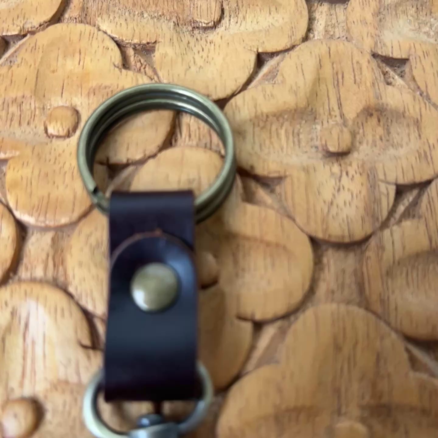 Video of William Shakespeare Horse Brass Medallion Keychain on wooden board