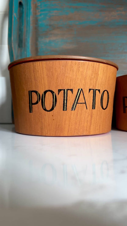 Video of teak snack bowl set with bold orange interior blue tray on white marble
